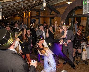 Covered outdoor courtyard under bulbs light creates a party style dance floor