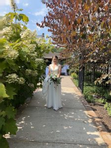 Bridal party gathers along the garden before walking down the aisle for outdoor ceremony near Pittsburgh