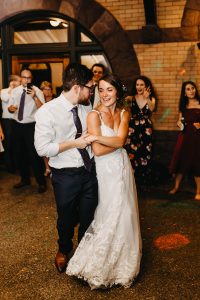 Bride and groom celebrate on the outdoor dance floor at their Beaver Station wedding reception